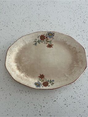 Antique Cream Oval Serving Platter with Rusty Red and Blue Floral Accents.